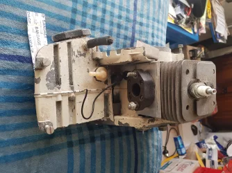 Rear view of Stihl 08s chainsaw engine.webp